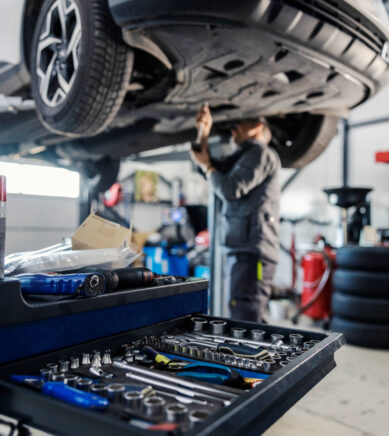 Selective focus on a drawer with auto-mechanic's tools with work